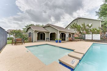 Pool area with spa and covered poolside cabanas
